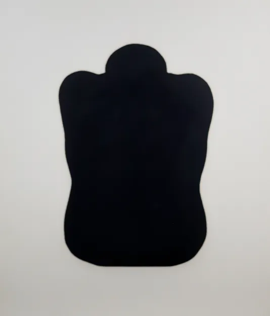 Black shape resembling a person huddled into a ball with their head poking out.