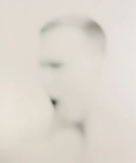 Faded portrait of a person that appears to be behind an opaque surface.
