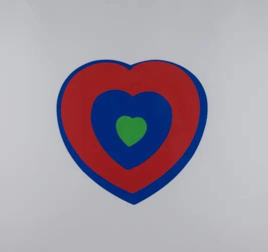Print of a blue heart with a red ring on the inside and a small green heart in the center.