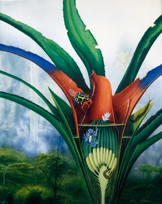 Red and green vibrant flower in the foreground with a tall waterfall and trees in the background.