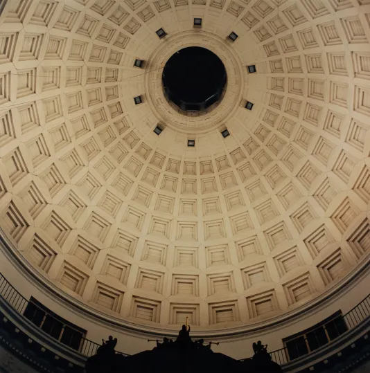 Photograph of a large church dome from below.