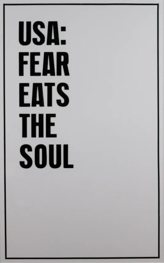White background with a thin black border with the text "USA: FEAR EATS THE SOUL" aligned on the top left.