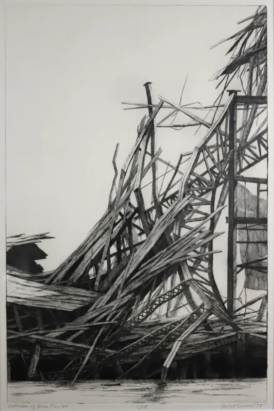Black and white photograph of a collapsed pier.
