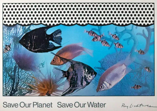 Black and white dots on the top fourth of the frame with a blue body of water and fish swimming through coral.