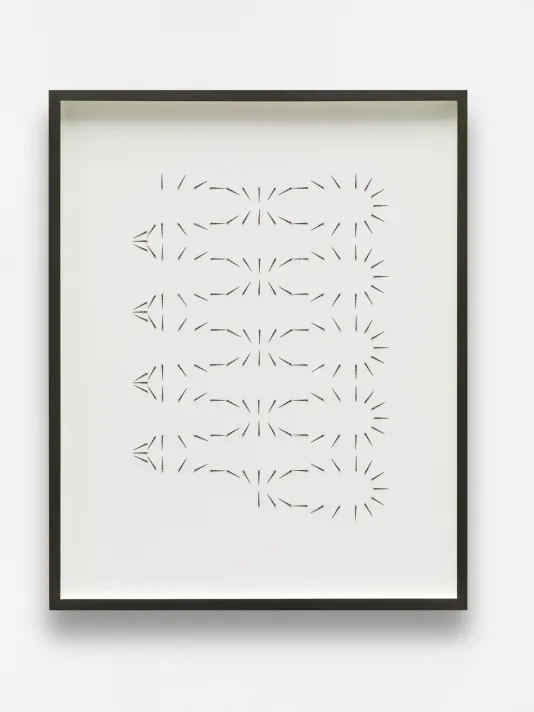 Drawing consisting of black hatch marks which form different shapes like a sun and an oval repeated 5 times vertically.