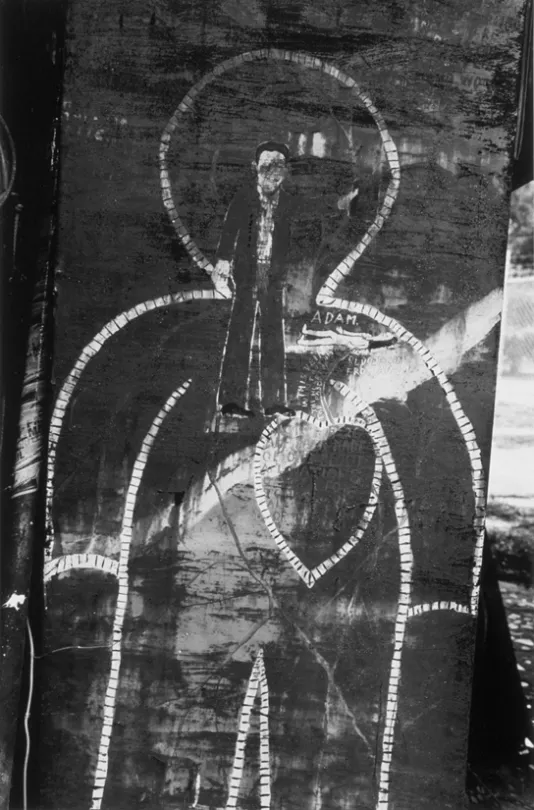 Black and white drawing of the outline of a human figure with a large heart on its chest and a much smaller figure on its face and neck.