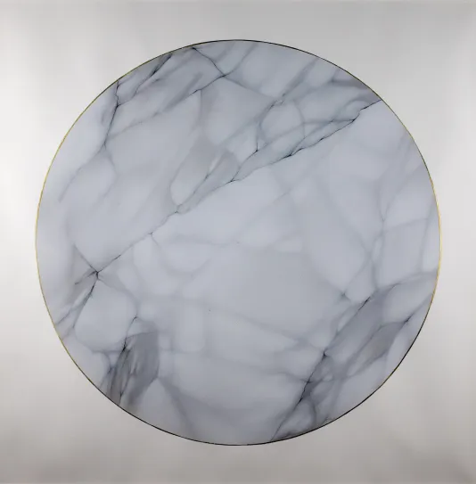 Circle on a square canvas with texture that resembles marble.