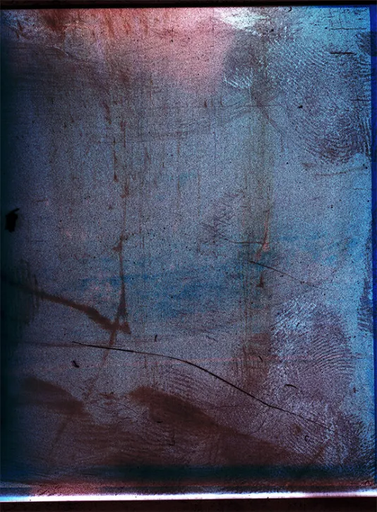 Textured dark blue and red prints with scratches and marks throughout.