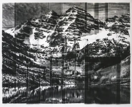 Black and white collage of photographs that come together to create a landscape shot of snow covered mountains.