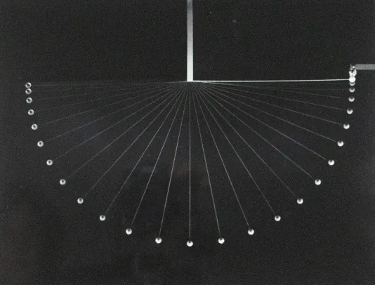 Pendulum shape swinging from left to right on a thin string.
