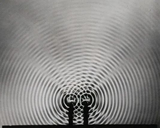 Swirls of motion reaching towards the outer edge of the frame getting fainter and fainter.